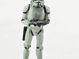 a toy figure of a stormtrooper holding a gun