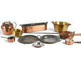 many different types of pots and pans on the table