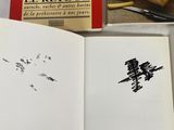 an open book with a picture of a bull on it