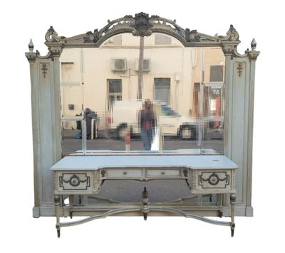 a white table with a mirror on it in front of a building