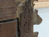 a piece of wood that has been torn off of the door