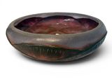 a bowl that is sitting on a white surface