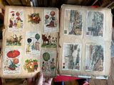 a person holding an open book with pictures on it