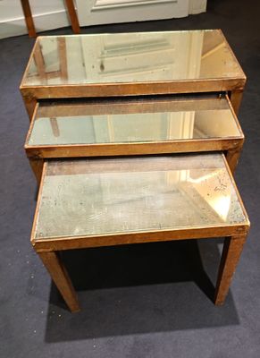 three tables that have glass tops on them in a room