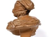 statue of a bust of a woman with a hat on her head