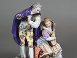 an image of a figurine of a man and a woman playing music
