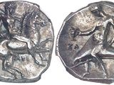 an image of a silver coin with an image of a man riding a horse