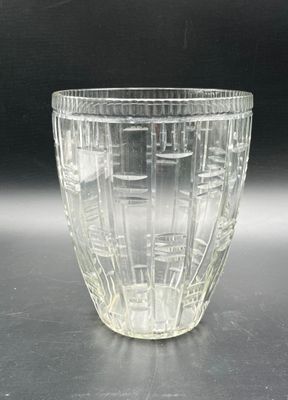 a glass cup that is sitting on a table