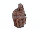 statue of a woman sitting on a chair holding a baby