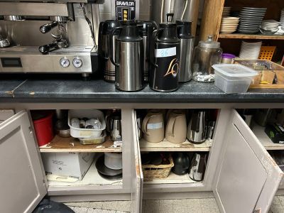 a coffee maker on the counter in the kitchen