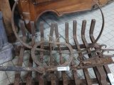 a metal bench that is on the floor in front of a door