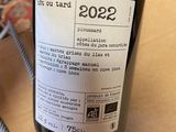 a bottle of wine that is sitting on a table