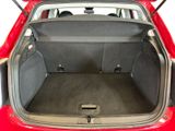 the back of a red car with its trunk open showing the cargo area