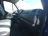 a view of the inside of a truck from the driver ' s seat