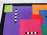 a colorful rug with squares of different colors on it