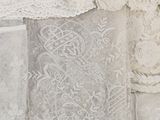 many different types of white lace on a table