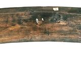 an image of a piece of wood with nails on it