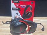 a pair of headphones sitting on top of a wooden table