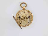 a gold pocket watch with a clock face and a pair of scissors