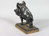 bronze sculpture of a pig on a marble base on a white background
