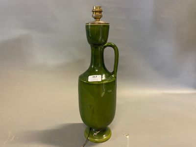an image of a green vase sitting on top of a table