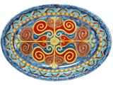 a picture of a blue and red plate with a design on it