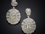 a pair of diamond and white gold earrings