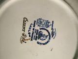 a white plate with a blue and white design on it