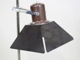 a lamp that is on top of a metal pole