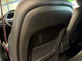 the interior of a car with the door open showing the dashboard