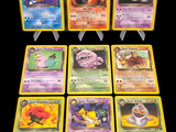 Plusieurs cartes Pokémon sont représentées sur un fond noir.