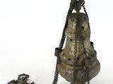 a metal object that is chained to a chain