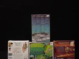 three nintendo wii games sitting on a black surface