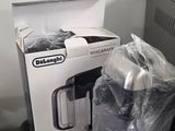 a box of food sitting on top of a table next to a microwave