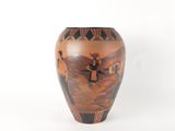 a vase that has a picture of a man on it