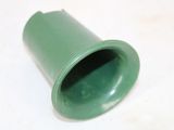 a green pipe on a white surface with a white background