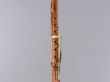 a clarinet with a wooden body and a black top