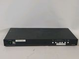 a black dvd player sitting on top of a white table