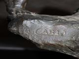 a close up of a sculpture of a dog ' s head