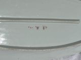 a white plate with a red writing on it
