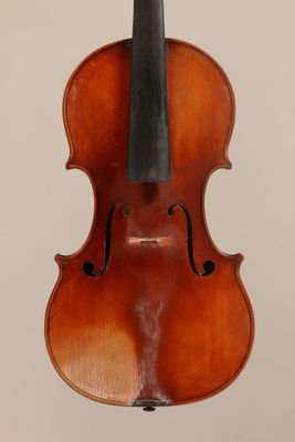 an old violin with a bow hanging from it ' s back