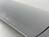 a close up of a car door handle and the door handle of the car