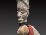 an image of a sculpture of a man with a hat on his head