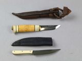 three different types of knives on a table