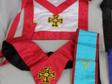 three masonic sashs, one with a cross, one with a cross and one with a cross on it