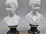 pair of porcelain busts of a boy and a girl