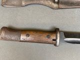 two knives that are sitting next to each other on a table