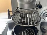 a mixer and a bowl on the counter in the kitchen