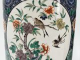 two vases with birds and flowers on them