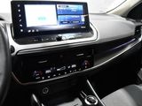 a picture of a car dashboard with a tablet on it